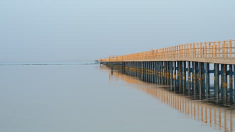 long wooden jetty at the pier of red sea in sharm el sheikh, egypt