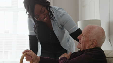 caregiver assisting senior man at home