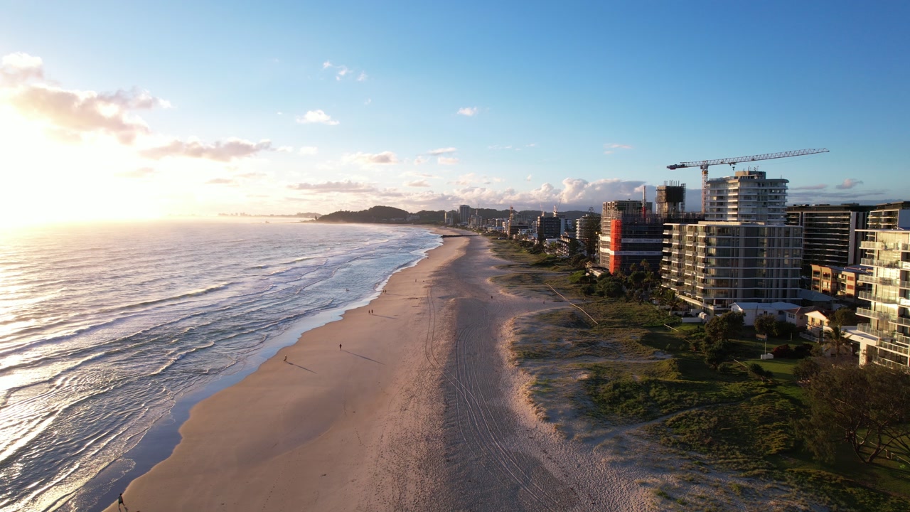 High-rise Beachfront Hotels At Palm Beach During Sunrise In Queensland, Australia. - aerial shot