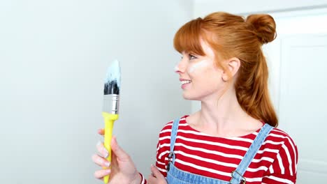 beautiful woman standing with paintbrush 4k