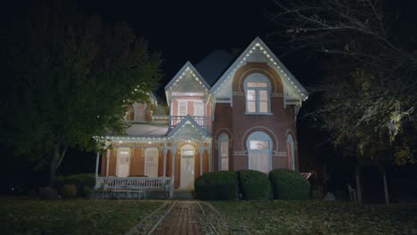 a lit up old haunted house