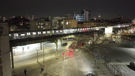 Aerial view of the subway passing through Brooklyn at night