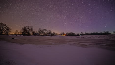 timelapse shot from night to morning time over snow covered along rural countryside