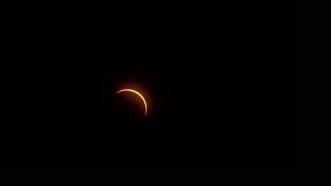 shortly after totality, a thin crescent outline of sunlight travels across the sky during a total solar eclipse