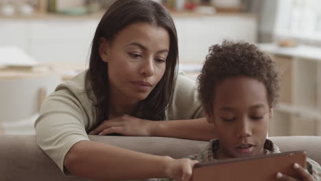 mother and son learning together on a tablet