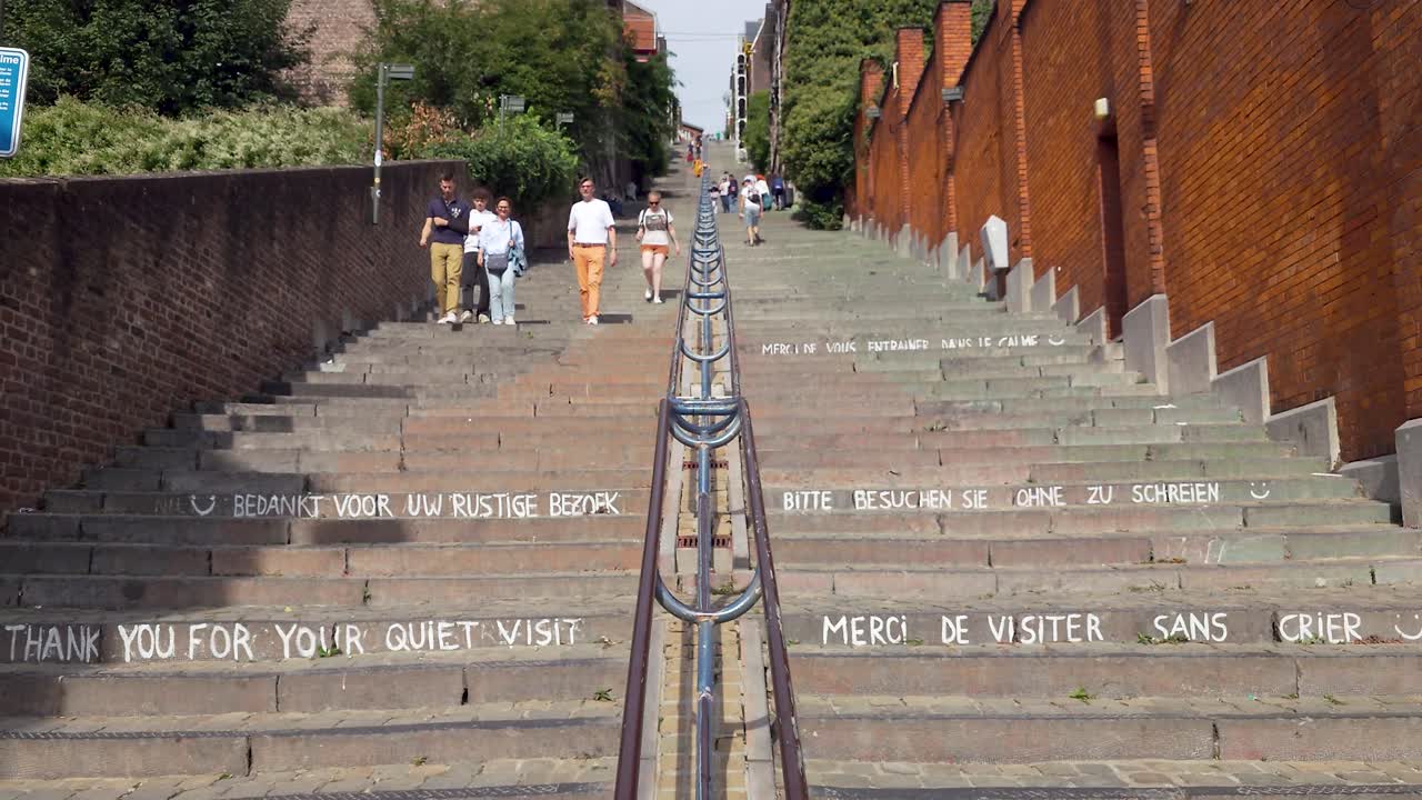 People walking on the staircase Montagne de Bueren in Liège, Belgium. The famous stairway has 374 steps and was built in 1881