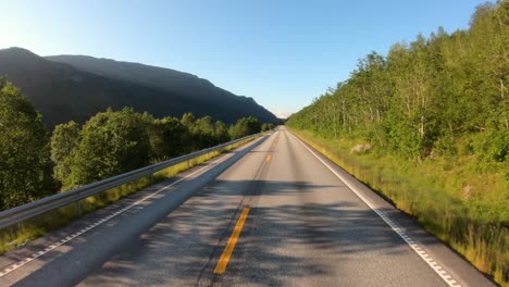 vehicle point-of-view driving a car on a road in norway