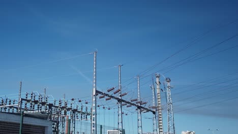 low angle view of energy station with blue sky in the background