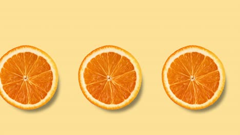 animación de bucle sin costuras con muchas rebanadas de naranja en un fondo amarillo pastel, espacio de copia