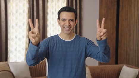 Proud-Indian-man-showing-victory-sign