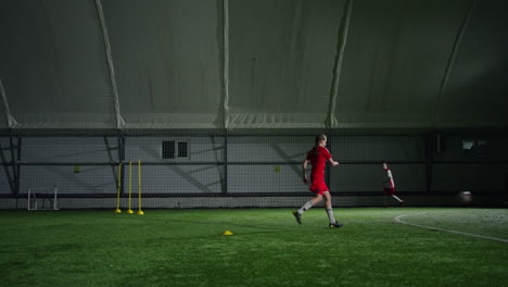 young female soccer players training indoors