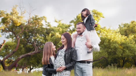 happy family portrait in a park