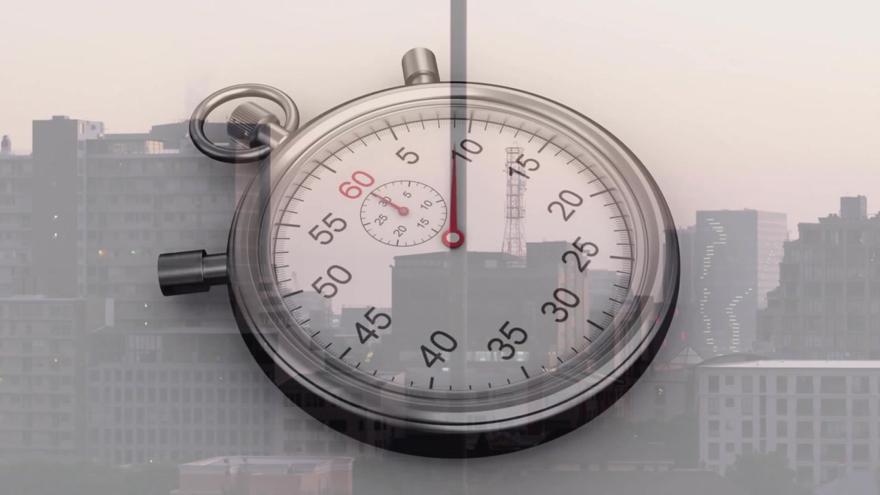 Stopwatch Overlaid on Urban Cityscape at Sunset