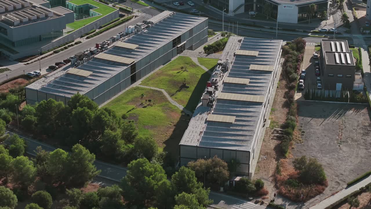 aerial view of modern industrial complex with green roofs in spain