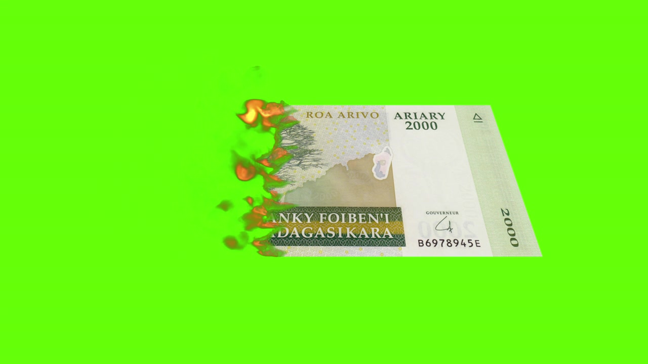 Billet de 2000 ariarys de Madagascar en feu sur fond vert