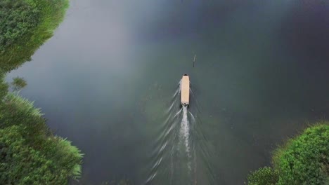 tourist boat in jungles of panama on gatun lake, aerial overhead view