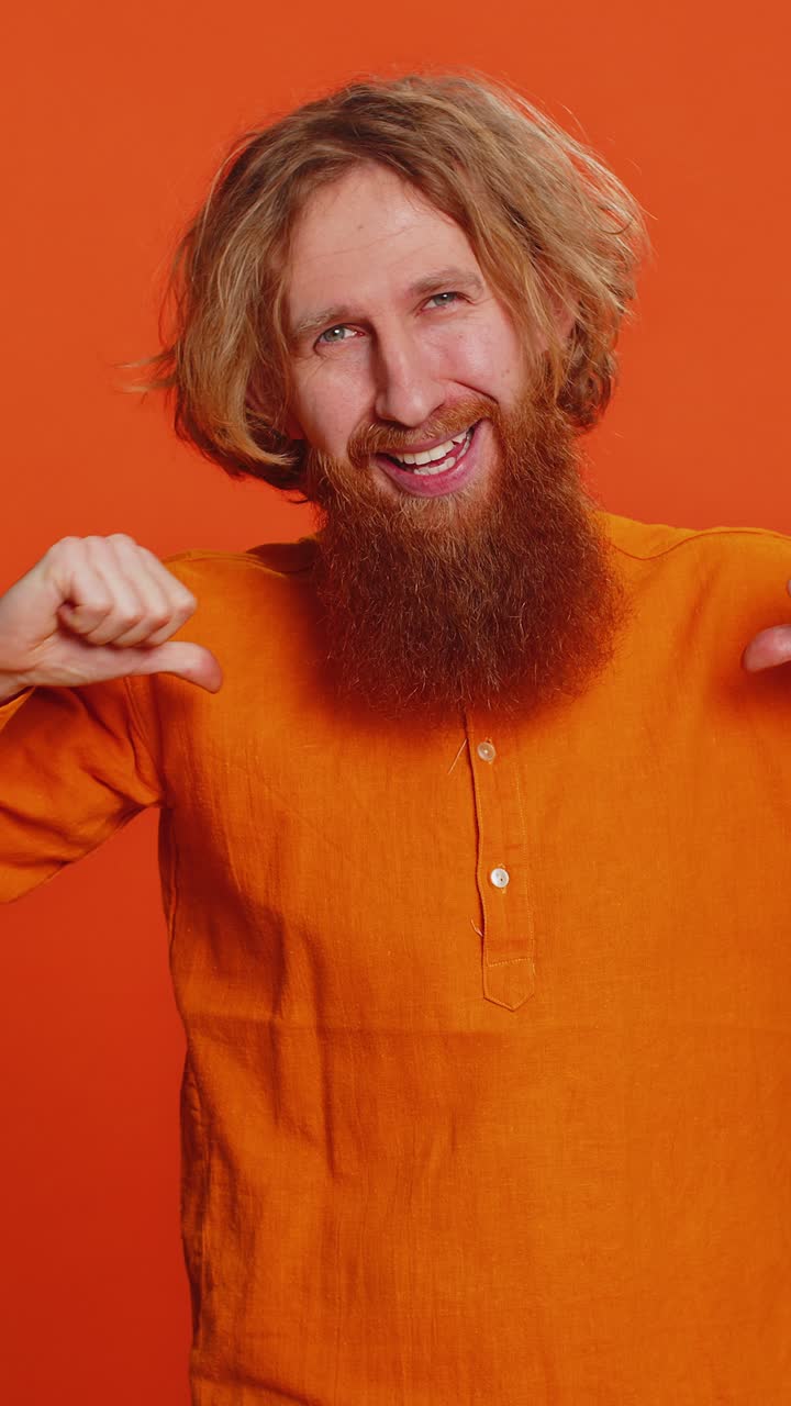 Caucasian man feeling very proud pointing himself overjoyed by success making choice selfconfident