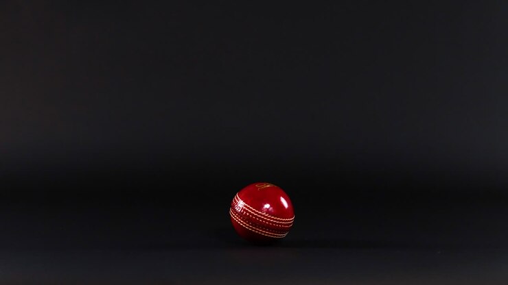 A cricket ball drops and bounces on surface