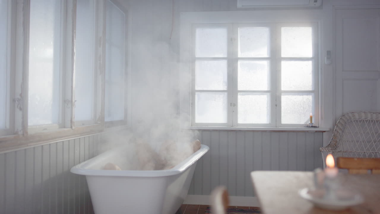 Man unwinding with hands behind head in hot steaming bath, wellness concept