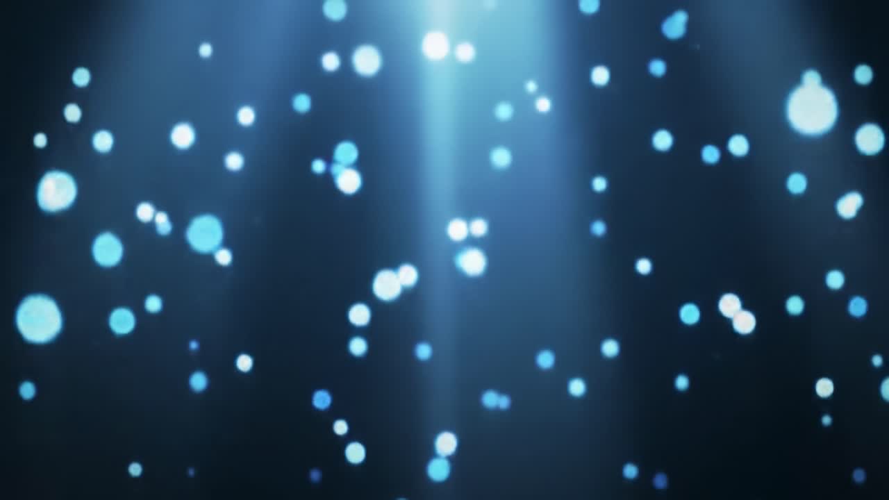 This captivating display features shimmering blue particles illuminated by beams of light against a dark backdrop, creating a tranquil atmosphere. Perfect for relaxation or inspiration.