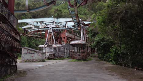 backward dolly drone flight inside the ruins of the old cable car station el liron, located in san antonio de galipan, venezuela