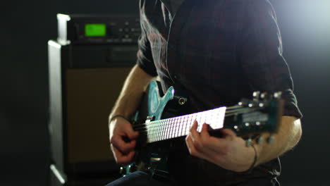 close up of man playing electric guitar shot on r3d