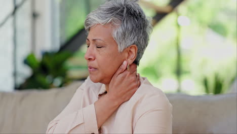 Neck-pain,-stress-and-senior-woman-on-a-sofa