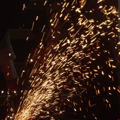 cutting steel with angle grinder in workshop