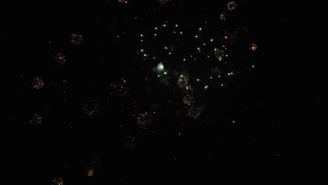 fireworks in slow motion on black background at night amazing and colorful graphic multiple explosions in a row