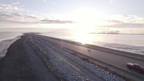 Cars-driving-on-waterfront-highway-leading-to-Tsawwassen-Vancouver-ferry-terminal,-Canada