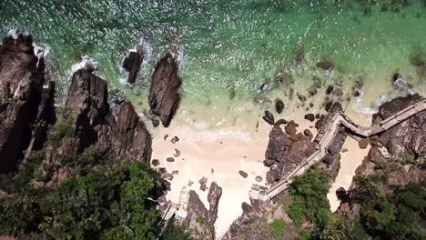 A-Drone-clip-from-above-at-an-empty-Tropical-Beach-on-Kapas-Island,-Malaysia-east-coast