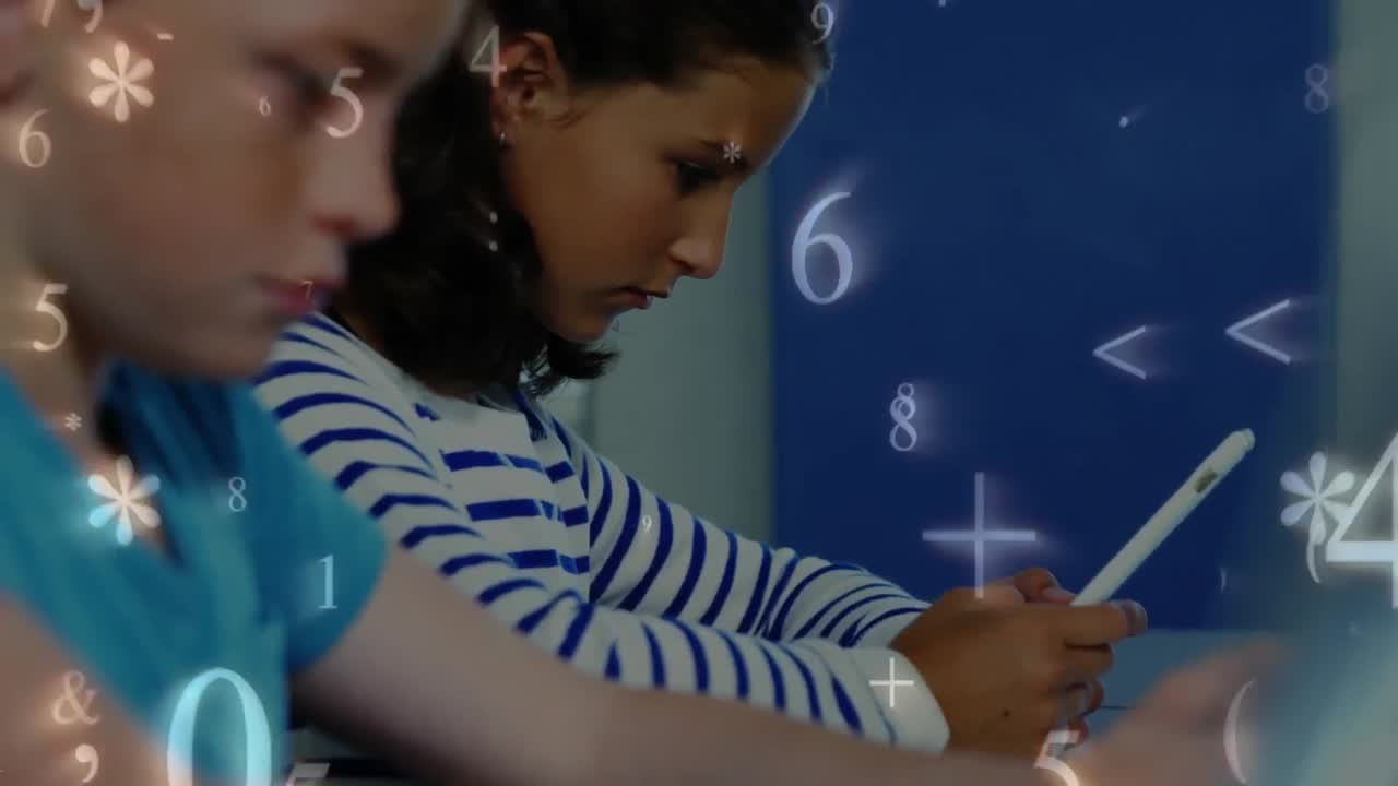 Schoolchildren studying while numbers and symbols move