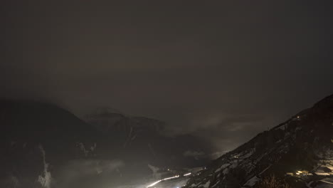 time lapse of sankt walburg in ultental during a cloudy night with fog