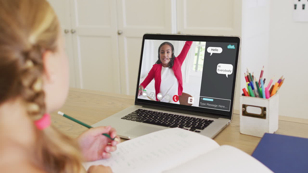 Composite video of girl using laptop for online lesson at home, with girl raising hand on screen