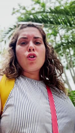 intense low angle view of a young woman with direct gaze