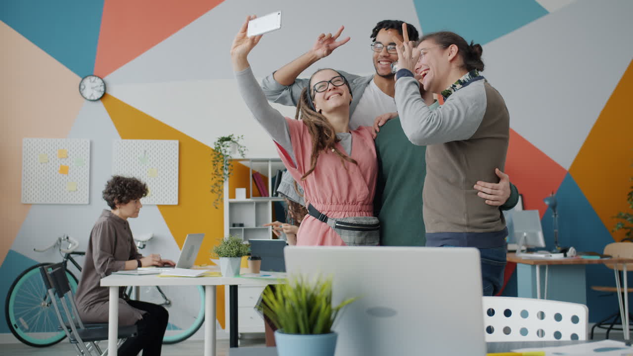 Happy Friends Taking a Selfie in a Modern Office