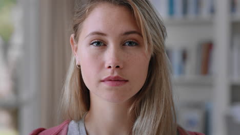 portrait beautiful blonde teenage girl at home looking serious expression