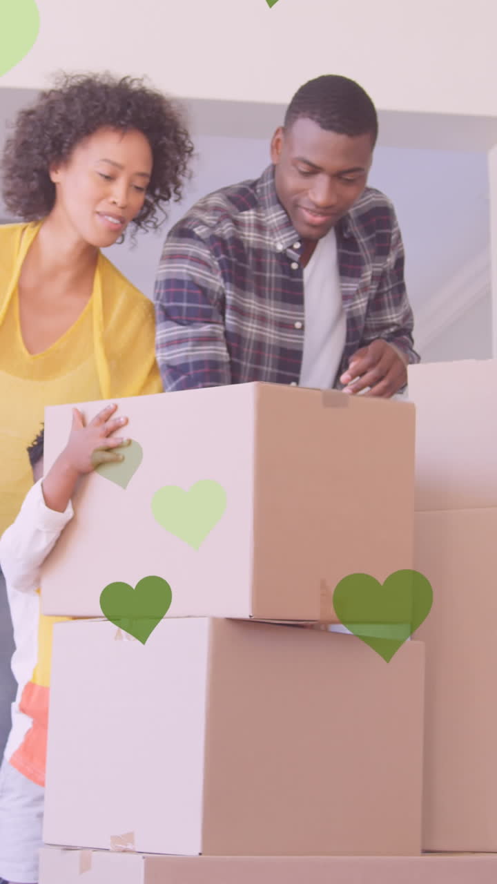 animación de iconos de corazón sobre una feliz familia afroamericana que se muda de casa