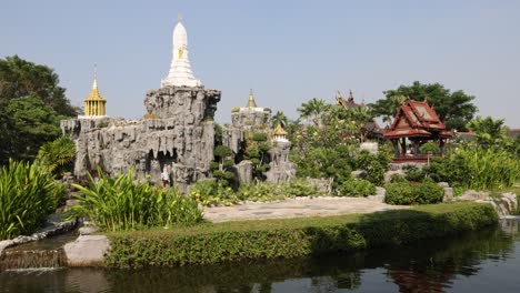 timelapse of a tranquil temple garden and pond