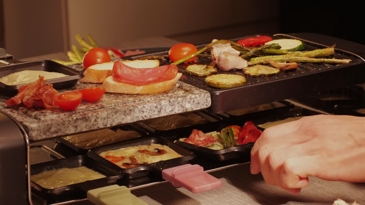 French Swiss or Spanish restaurant with traditional tapas food, Spanish cuisine, delicious tapas and cheese plate, bruschetta with cheese, olives dry tomatoes and tasty sandwich bar appetizer, buffet