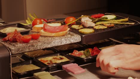 french swiss or spanish restaurant with traditional tapas food, spanish cuisine, delicious tapas and cheese plate, bruschetta with cheese, olives dry tomatoes and tasty sandwich bar appetizer, buffet