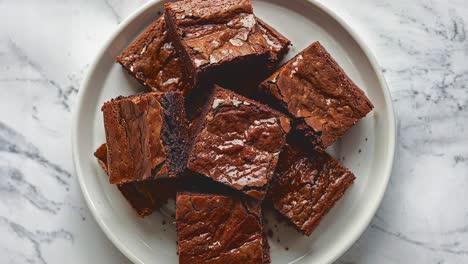 delicious chocolate brownies arranged on a white plate