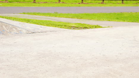 Young-skateboarder-skating-the-outdoor-skatepark