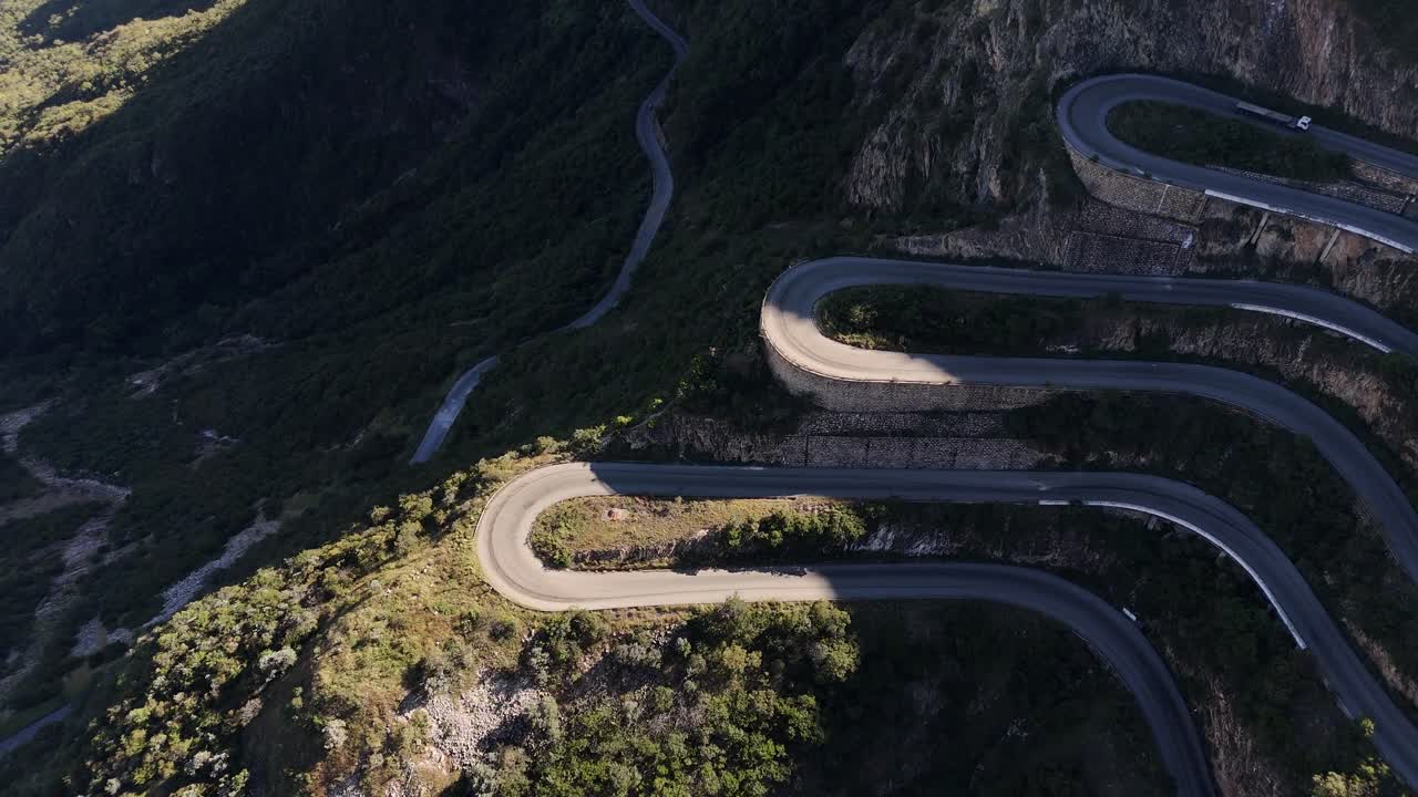Drone shot over Leba Pass, one of Angola’s most iconic mountain roads, with sweeping turns, cliffs, and panoramic views of the Huíla province