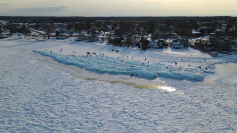 overhead drone shot of blue ice in the straits of mackinac in mackinaw city, michigan