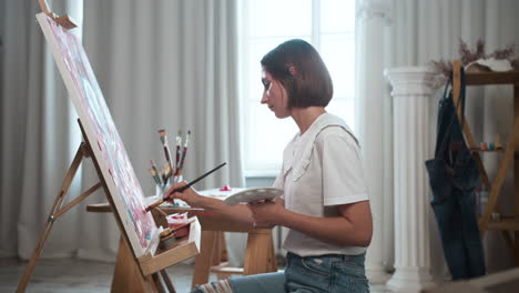 Artist-painting-with-a-brush