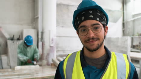 man examining marble