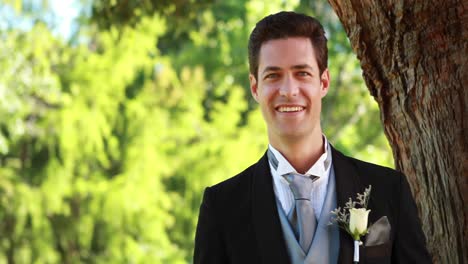 happy groom smiling at camera