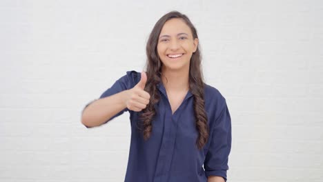 indian girl showing thumbs up