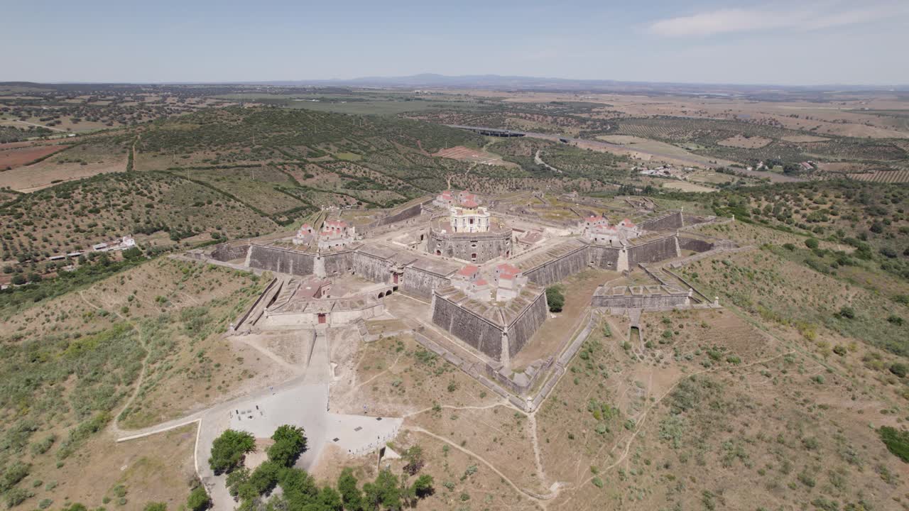 Aerial fly-by around Nossa Senhora da Gra&ccedil;a Fort, passing through up close, Elvas, Portugal
